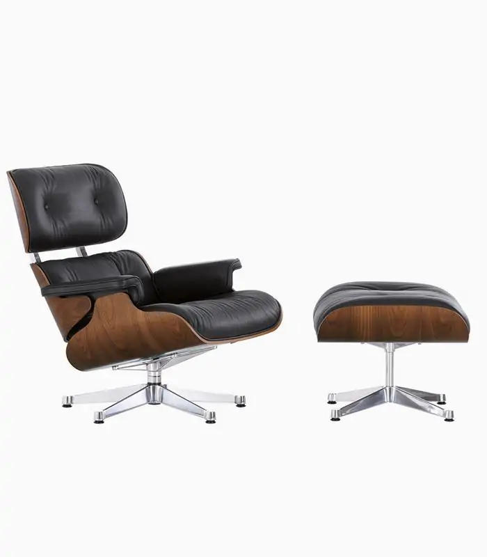 Black Eames-style lounge chair and ottoman showing molded wood shell and aluminum base