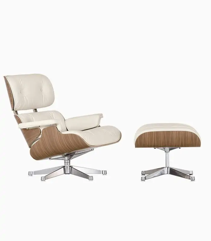 Cream Eames-style lounge chair and ottoman with light wood shell
