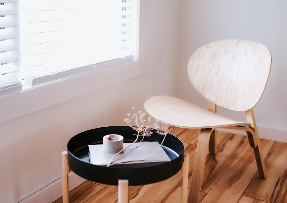 Japandi bedroom with neutral wood tones and linen textiles