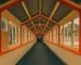 Wes Anderson aesthetic interior — symmetrical hallway with orange trim, vintage windows, and pastel walls