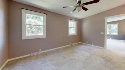 Soft greige painted living room with warm light and oak floors