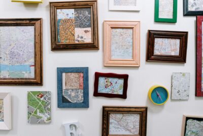 Gallery wall with mixed frames and prints above a sofa