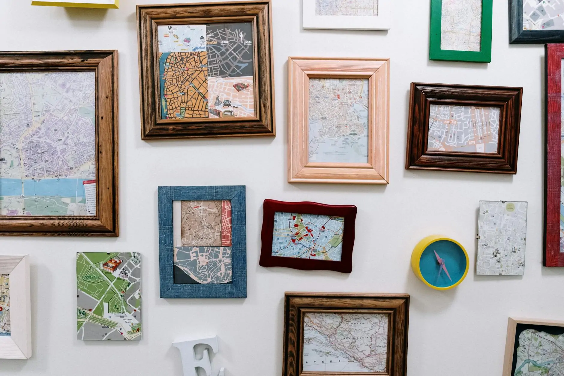 Gallery wall with mixed frames and prints above a sofa