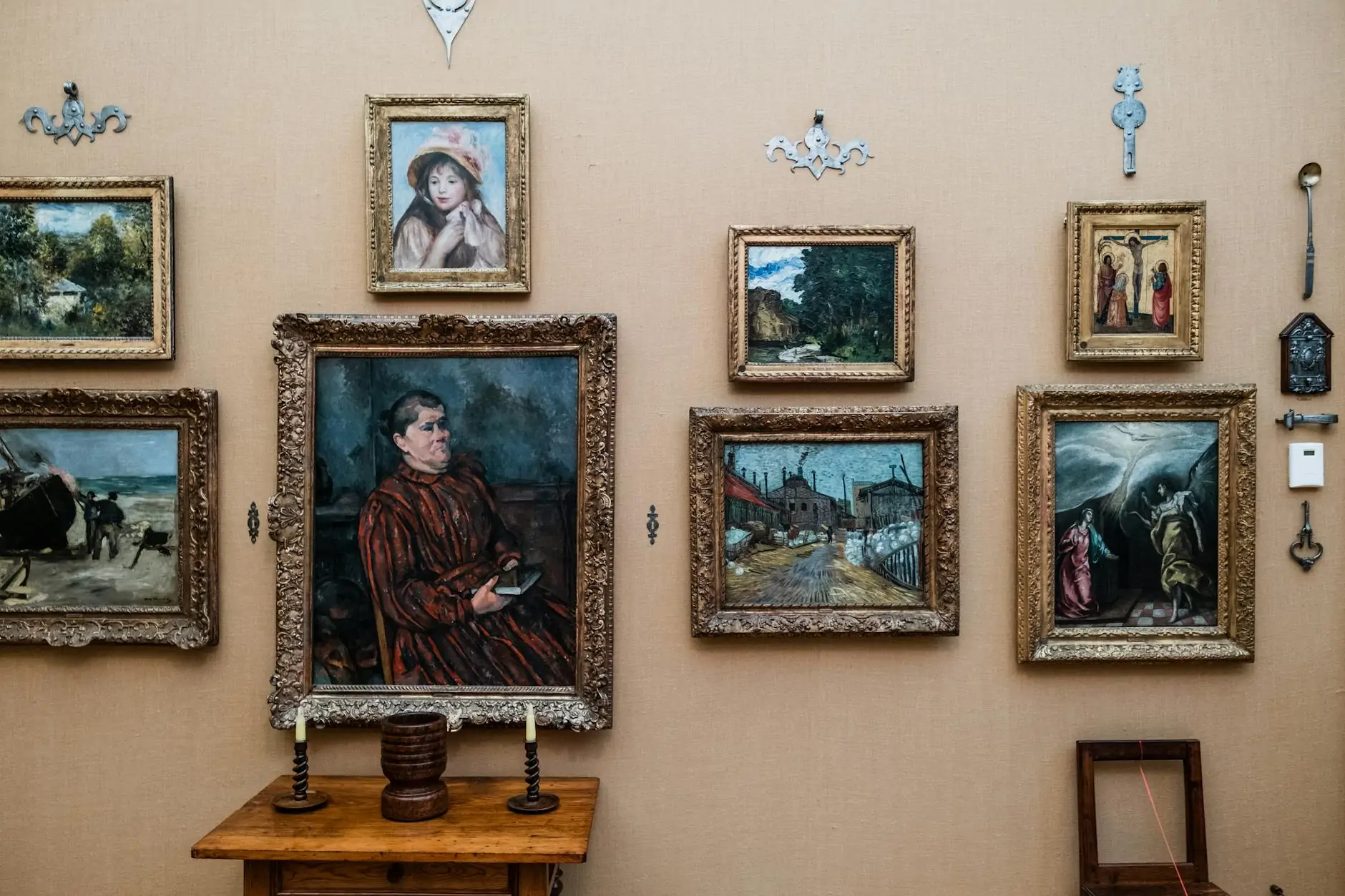 Salon-style gallery wall with dense frame arrangement