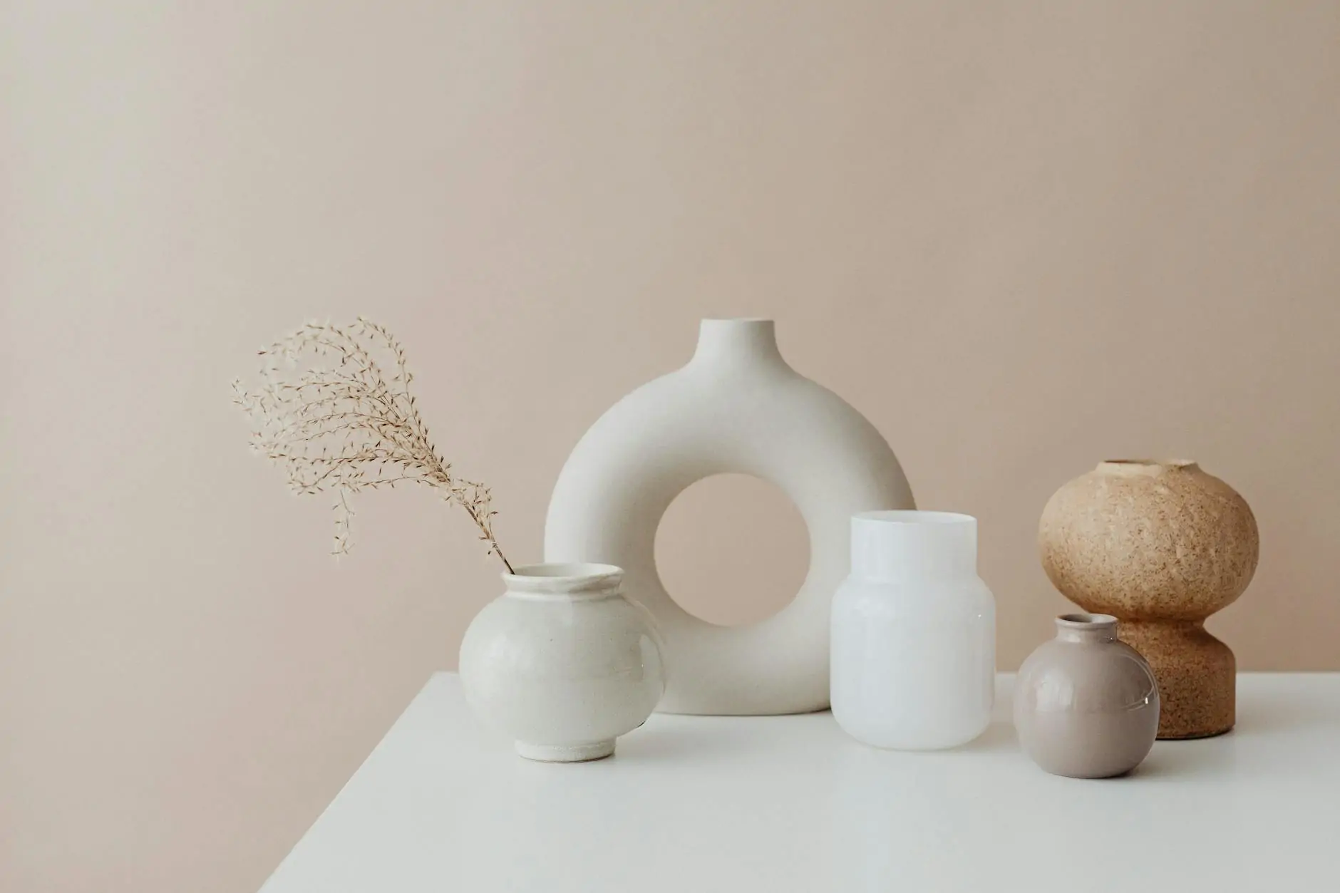 Single handmade pottery vase on a wooden table
