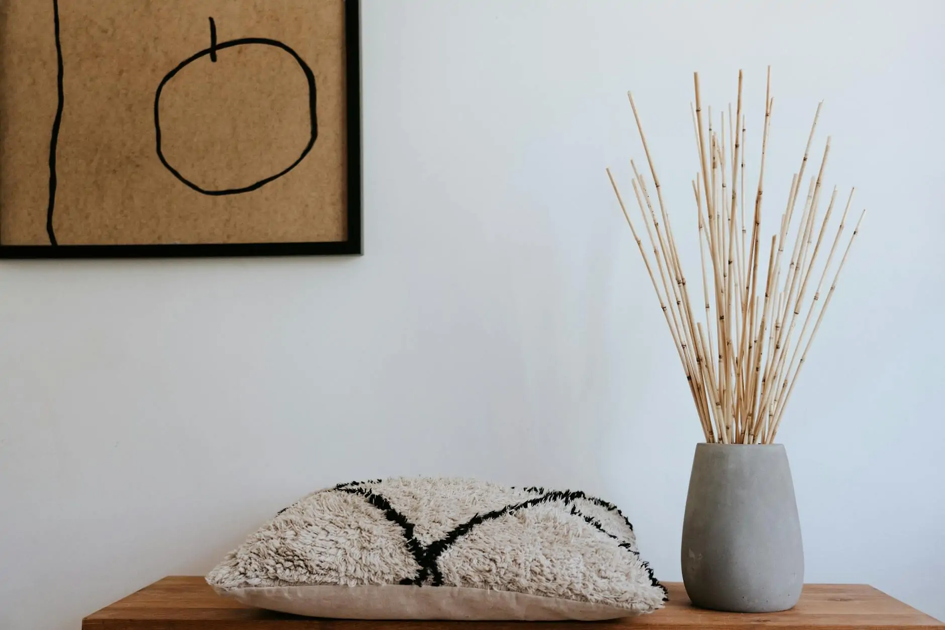 Japandi color palette interior with warm whites, oak wood and soft black accents