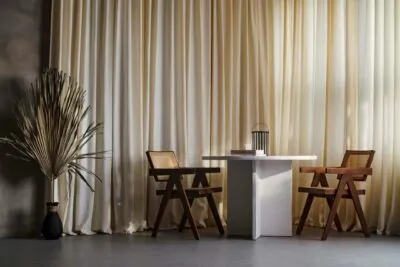 Japandi furniture: oak chair and low wooden bench in neutral interior
