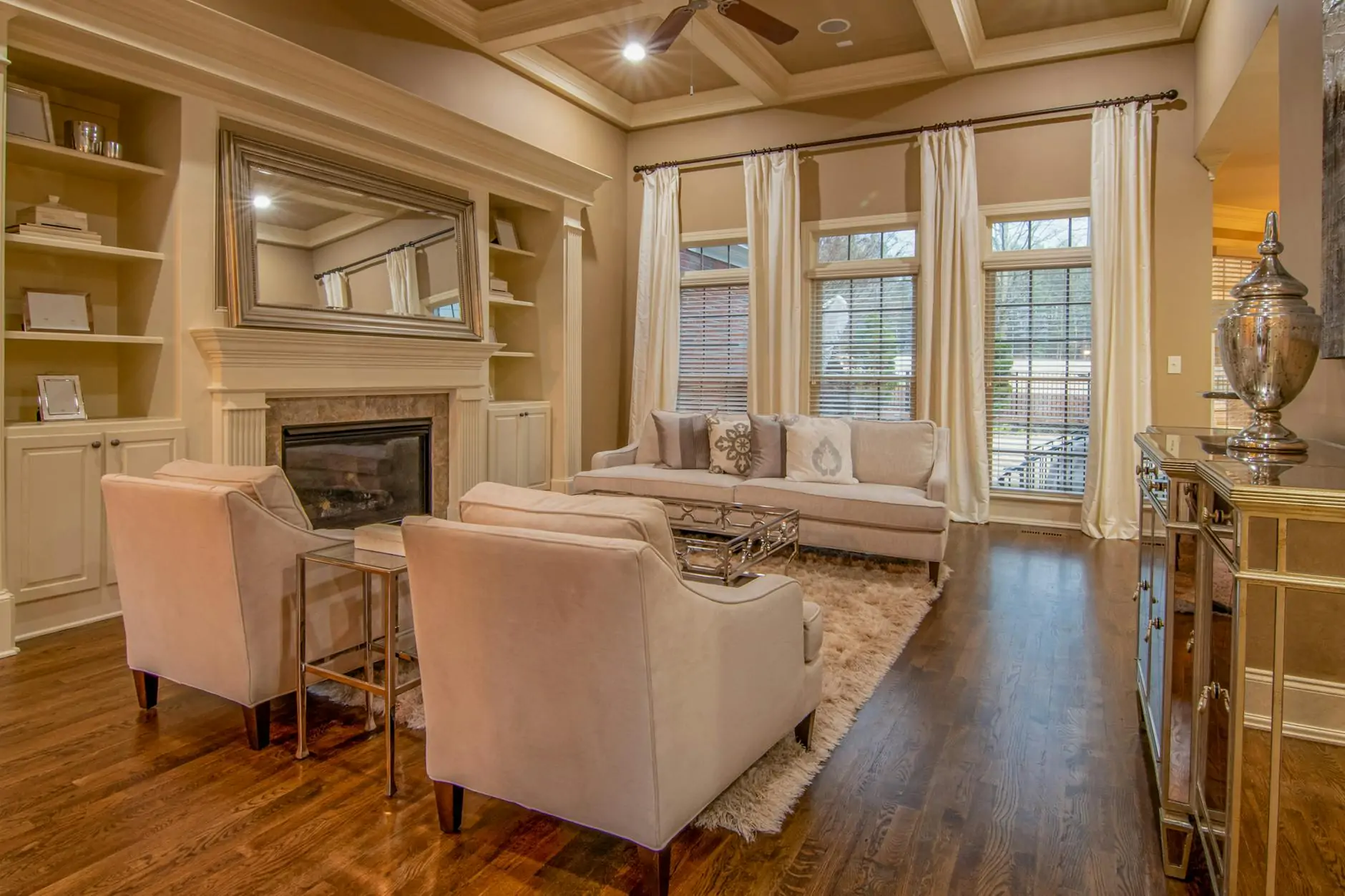 Quiet luxury living room with cashmere throw, marble and warm wood