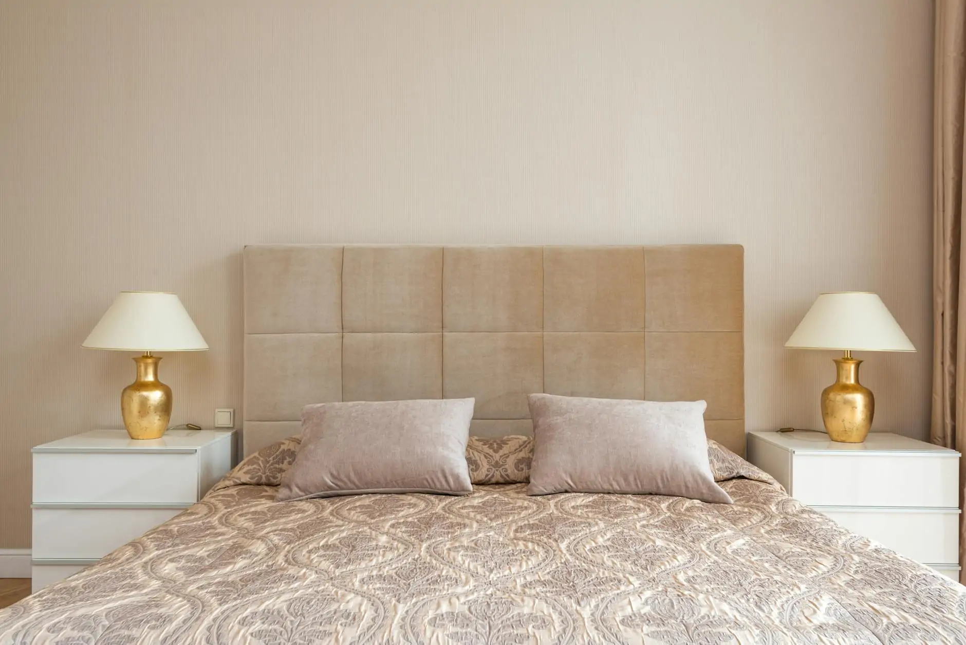 Quiet luxury bedroom with cashmere bedding and linen drapery