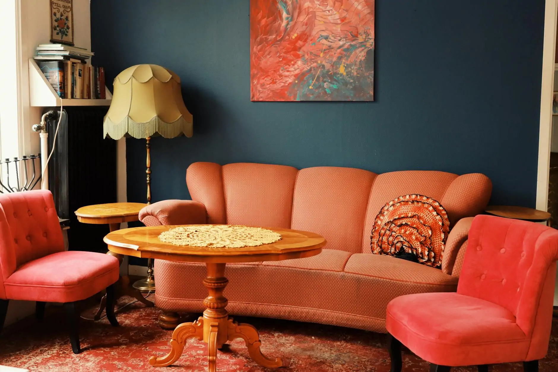 Velvet armchair in a richly styled bedroom corner