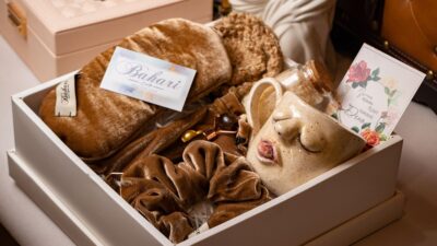 Luxury wellness gift box with self-care items on a home spa table