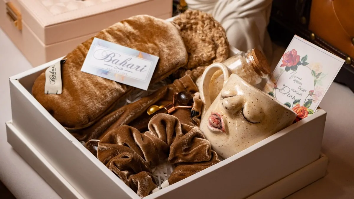 Luxury wellness gift box with self-care items on a home spa table