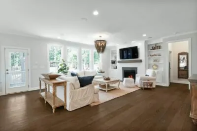 Bright staged living room with neutral decor and natural light