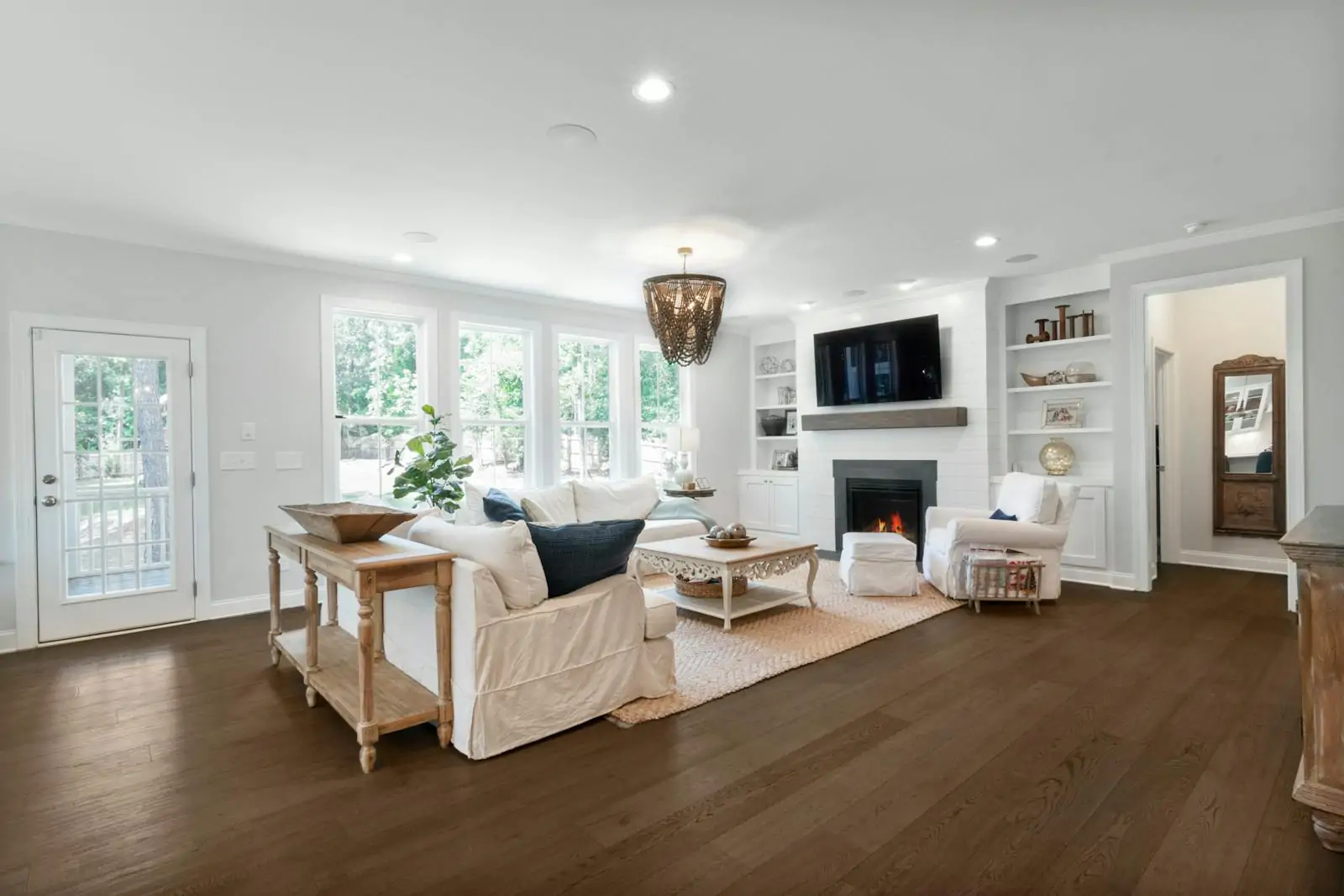 Bright staged living room with neutral decor and natural light market-ready home design updates kooihaus.com