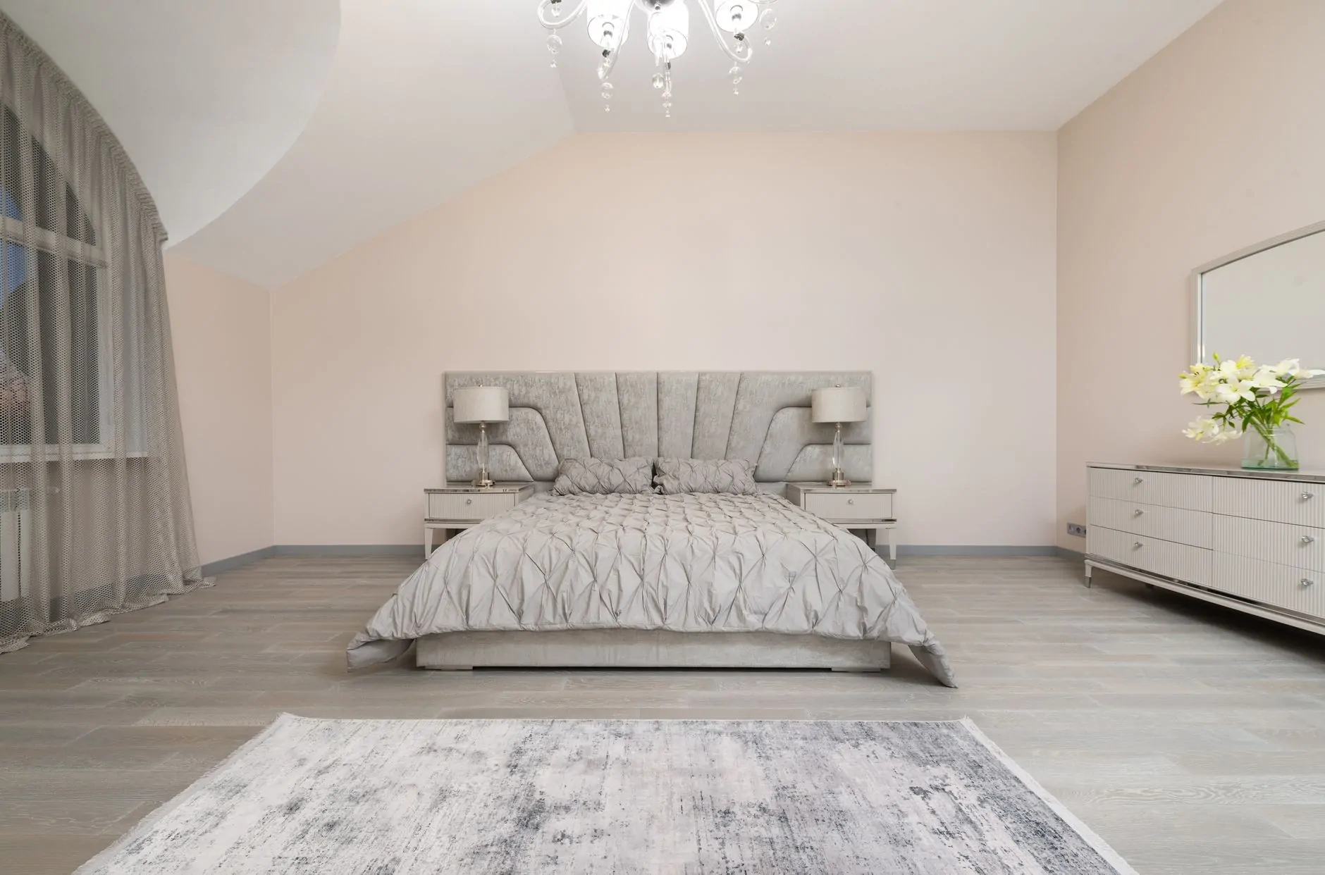 Bedroom rug positioned to create a soft landing beside the bed