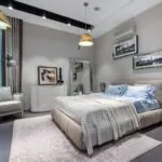 Bedroom with a large rug extending beside and beyond the bed