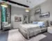 Bedroom with a large rug extending beside and beyond the bed