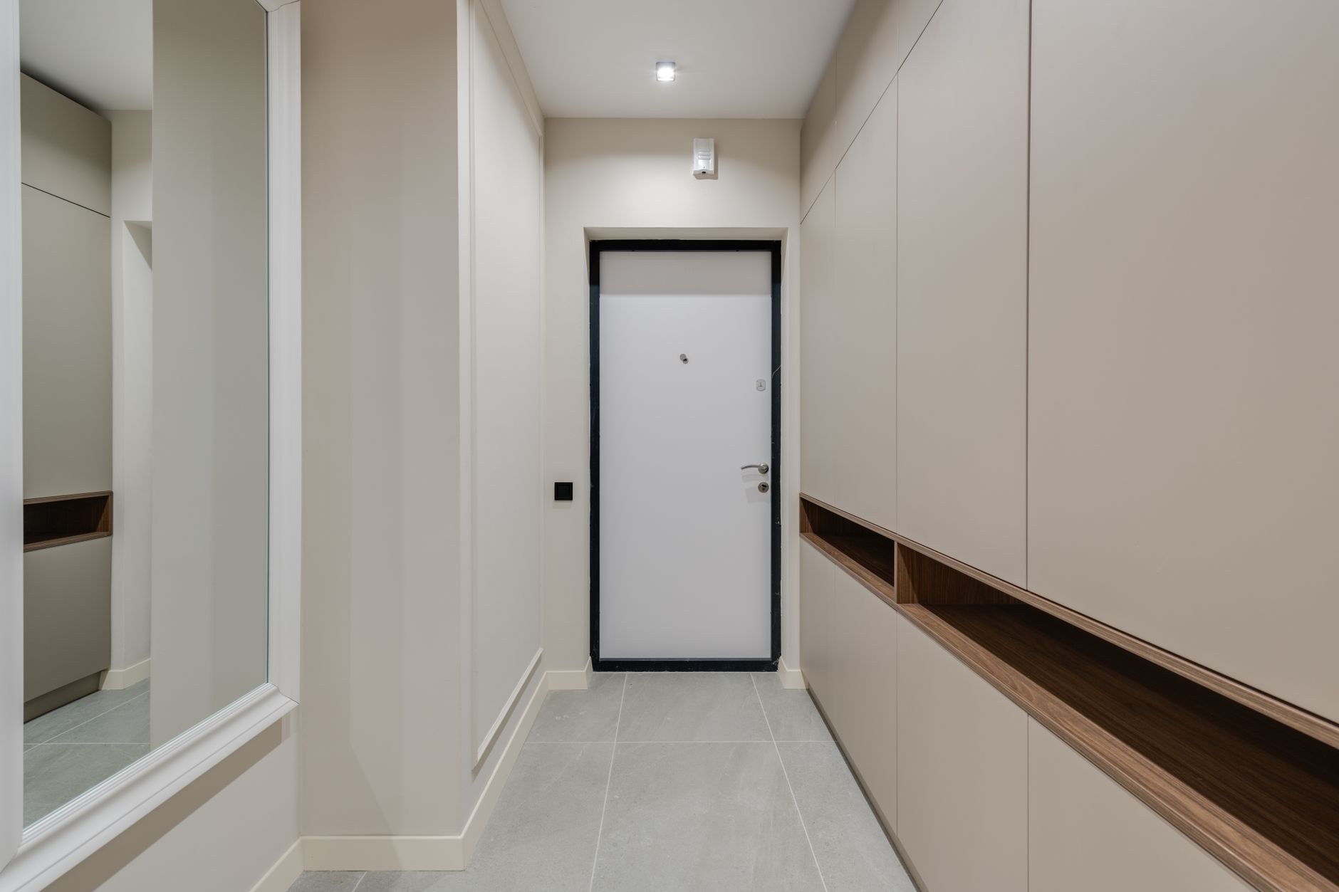 Integrated entryway cabinetry with a practical landing zone