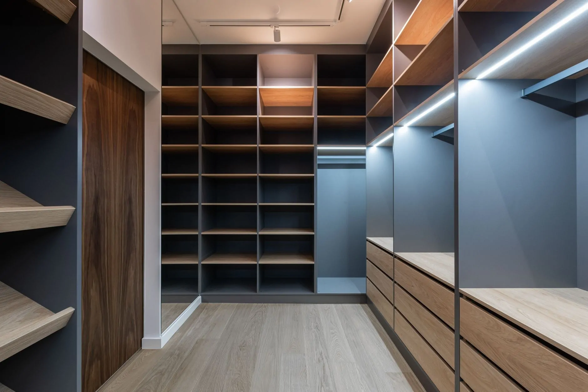 Built-in hallway storage with bench and closed cabinetry