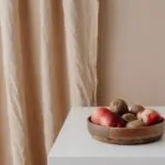 Low fruit bowl on a clear kitchen counter