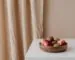 Low fruit bowl on a clear kitchen counter