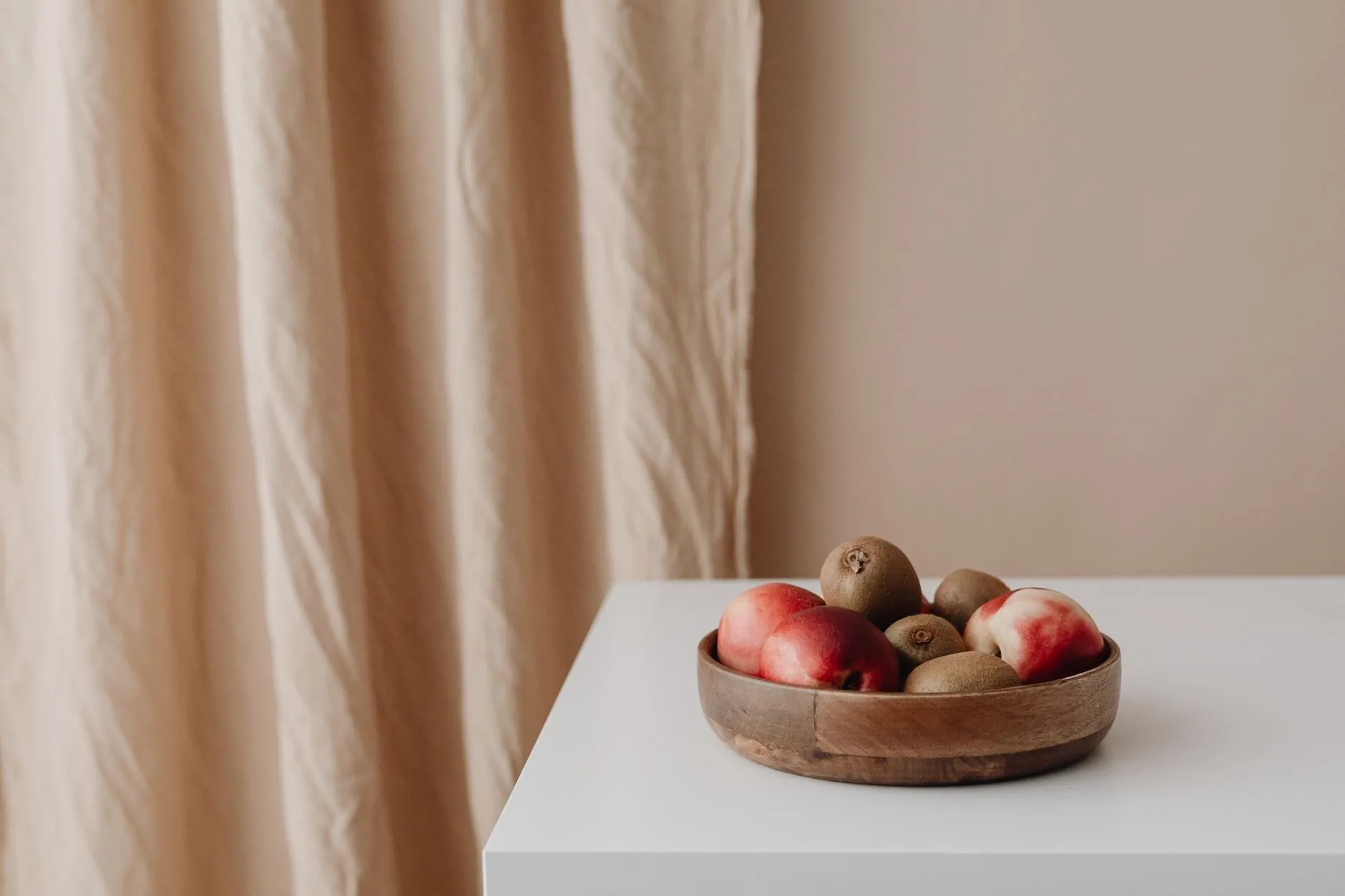 Low fruit bowl on a clear kitchen counter