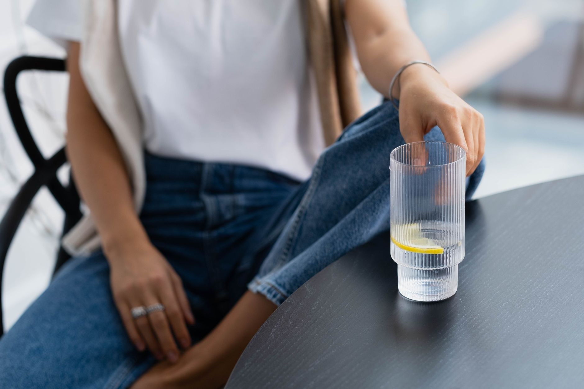 Clear ribbed tumblers on a restrained dining table