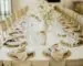 Neutral textured napkin beside simple ceramic dinnerware