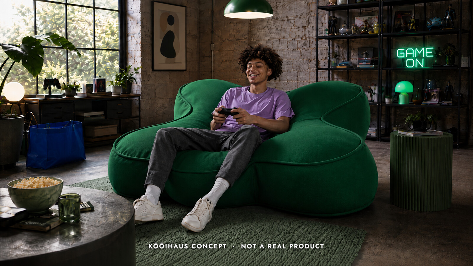 Kooihaus concept illustration: a person gaming on an oversized green D-pad-shaped lounge in a loft. Not a real product.