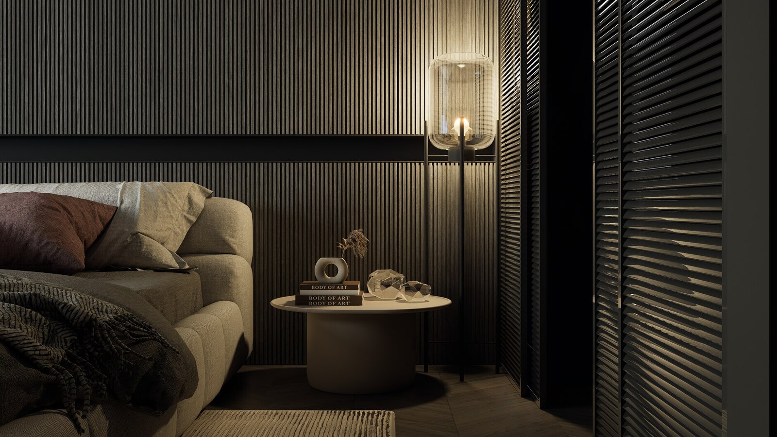 A dark, moody bedroom with a textured feature wall, warm bedding, and layered ambient lighting