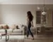 A warm greige living room with an empty painted wall, in Benjamin Moore quiet-luxury neutral tones