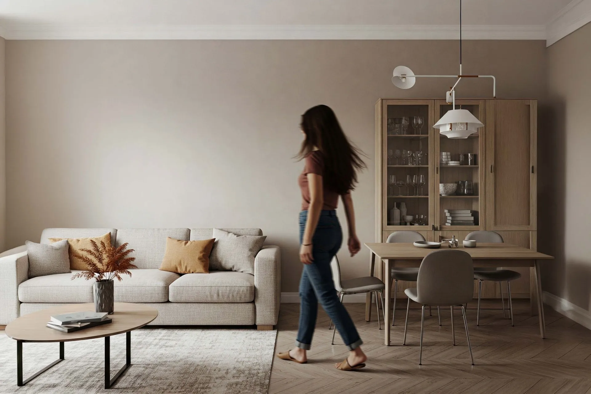 A warm greige living room with an empty painted wall, in Benjamin Moore quiet-luxury neutral tones