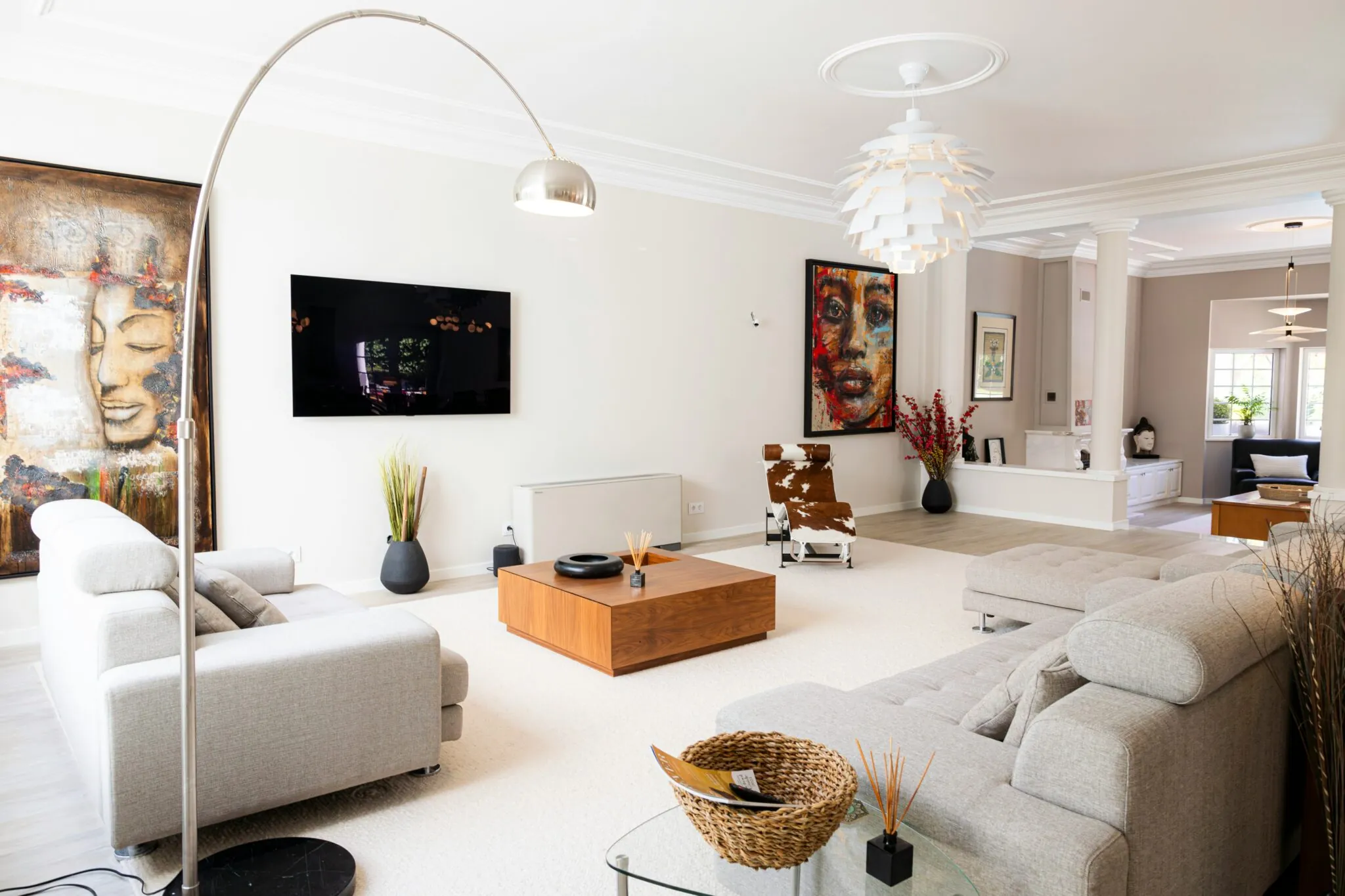 Bright staged living room with well-spaced seating and a clear circulation path