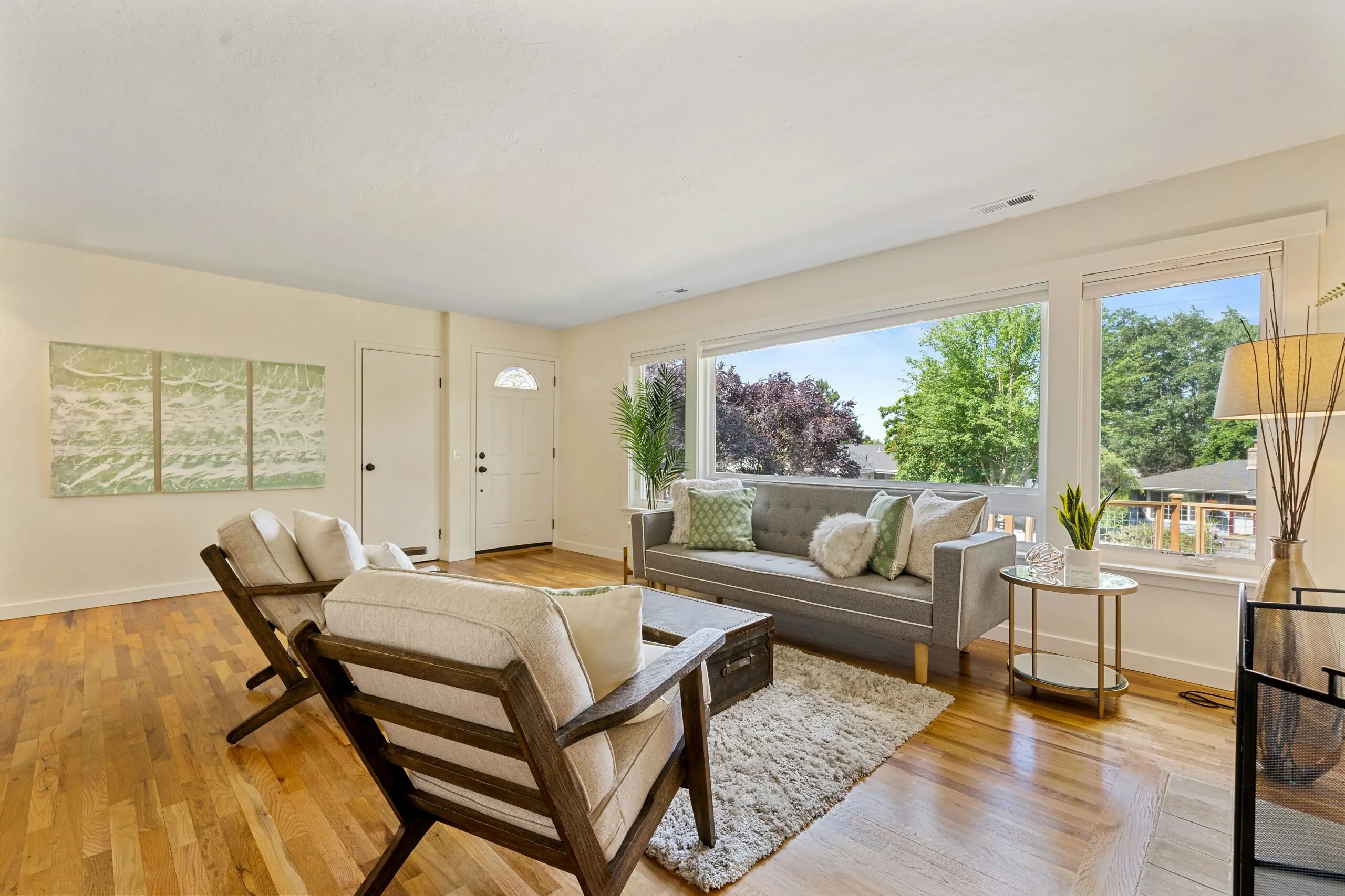 Staged living room with appropriately scaled seating and visible open floor