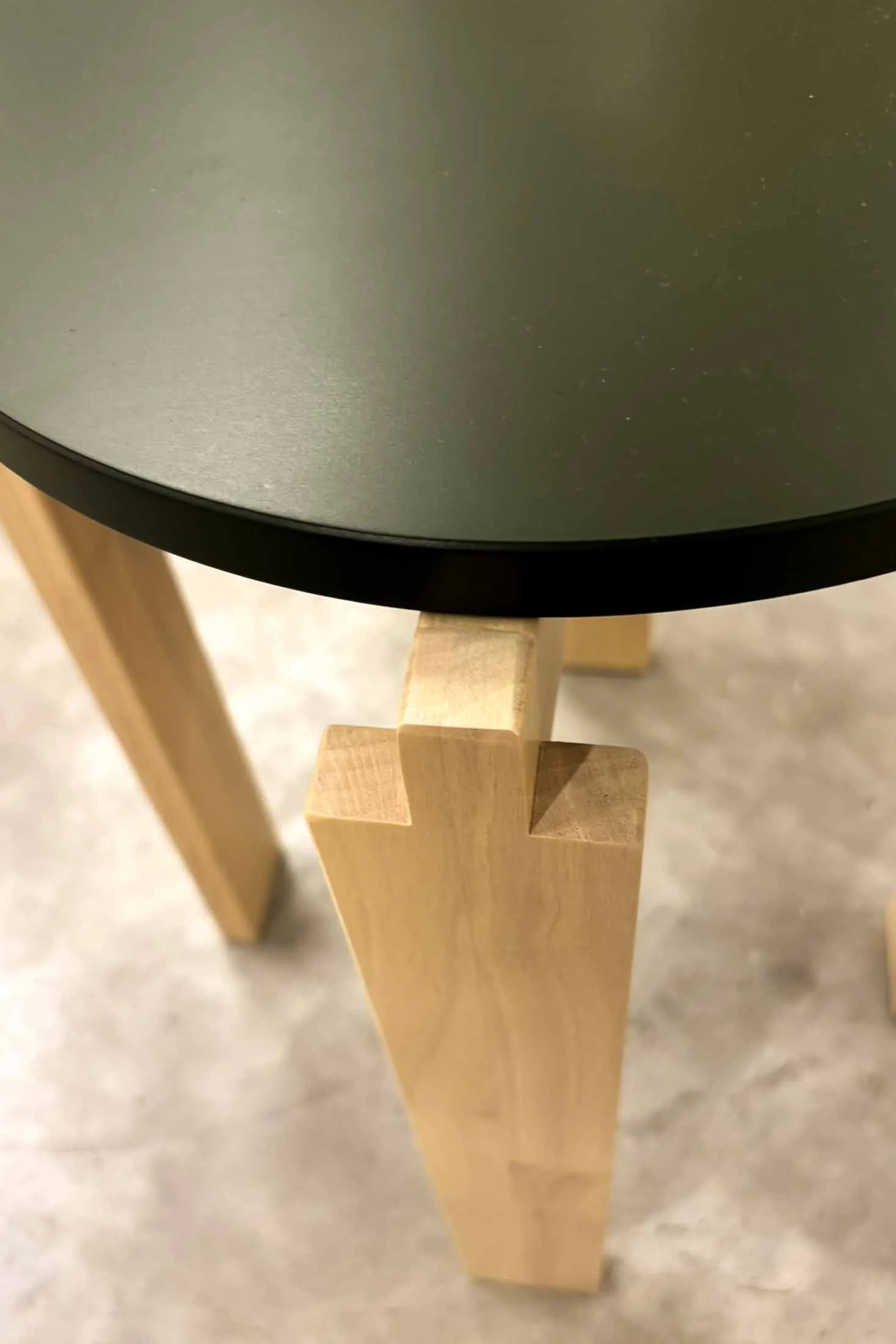 Side view of the stepped notch cut into a solid birch IKEA KOMPISHÄNG stool leg