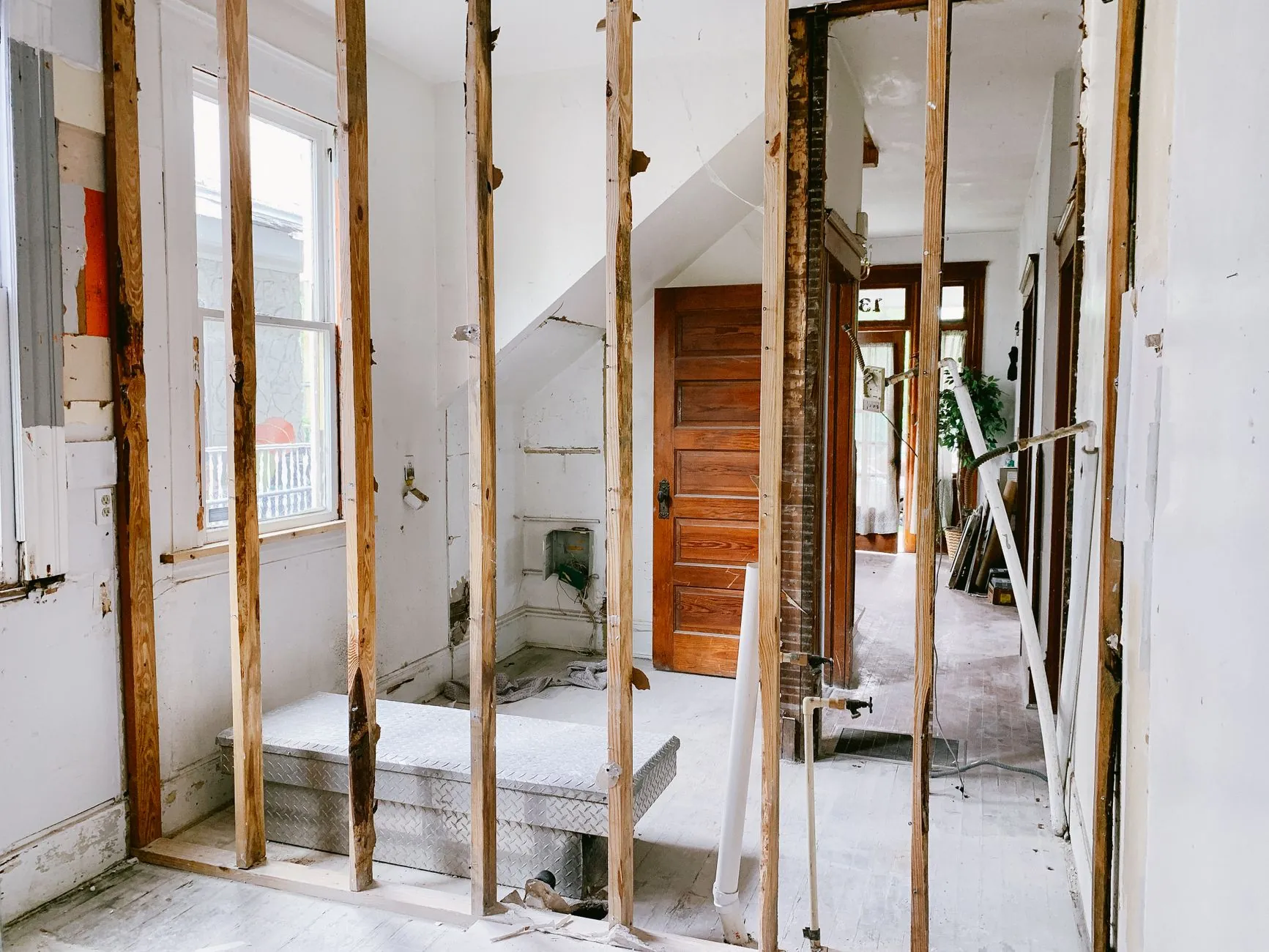 An interior under renovation with exposed timber wall framing