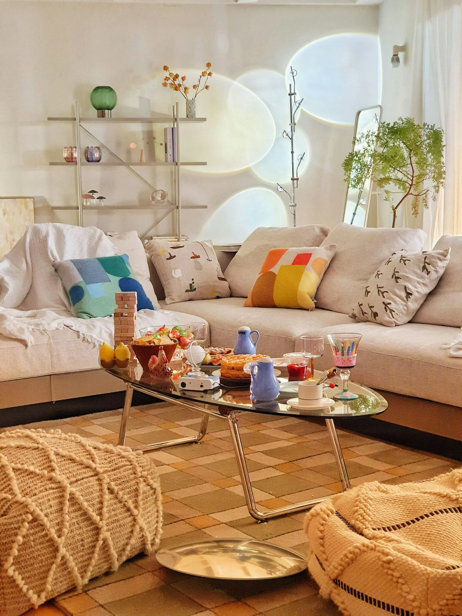 Warm small living room with a modular sofa, colorful cushions and a coffee table