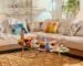 Warm small living room with a modular sofa, colorful cushions and a coffee table