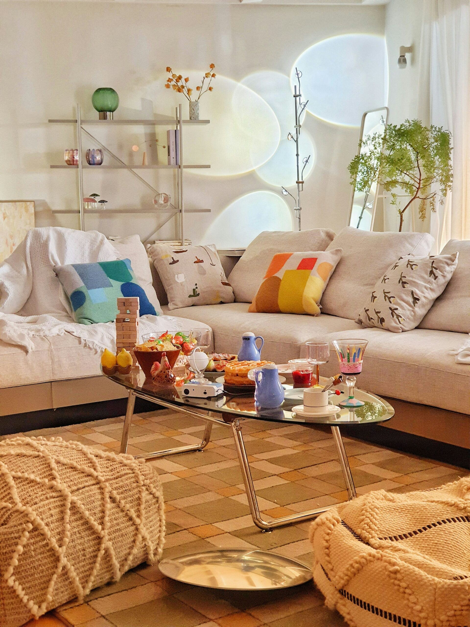 Warm small living room with a modular sofa, colorful cushions and a coffee table