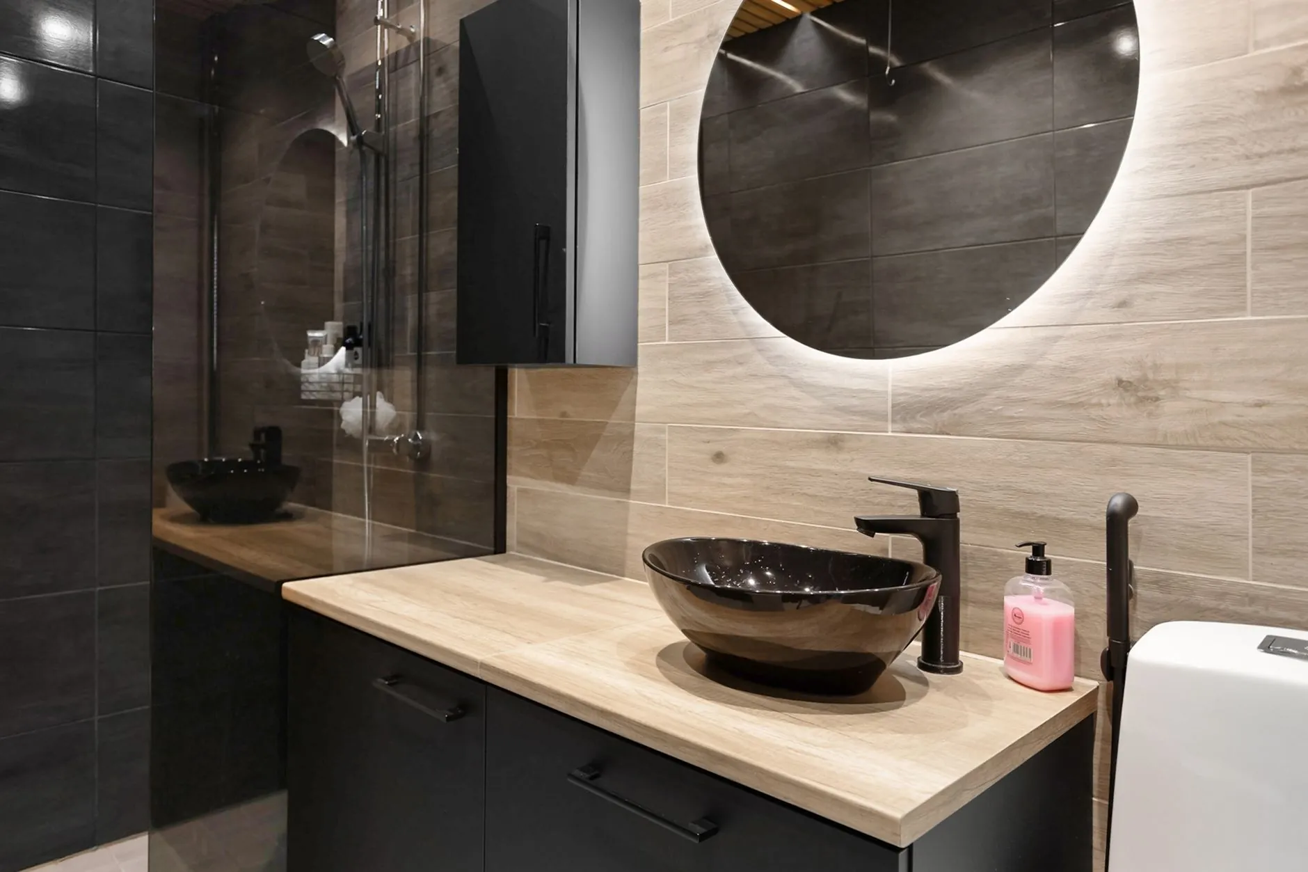 Compact modern bathroom vanity with drawers and a wall-mounted cabinet