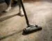 Vacuum cleaner moving across a patterned area rug