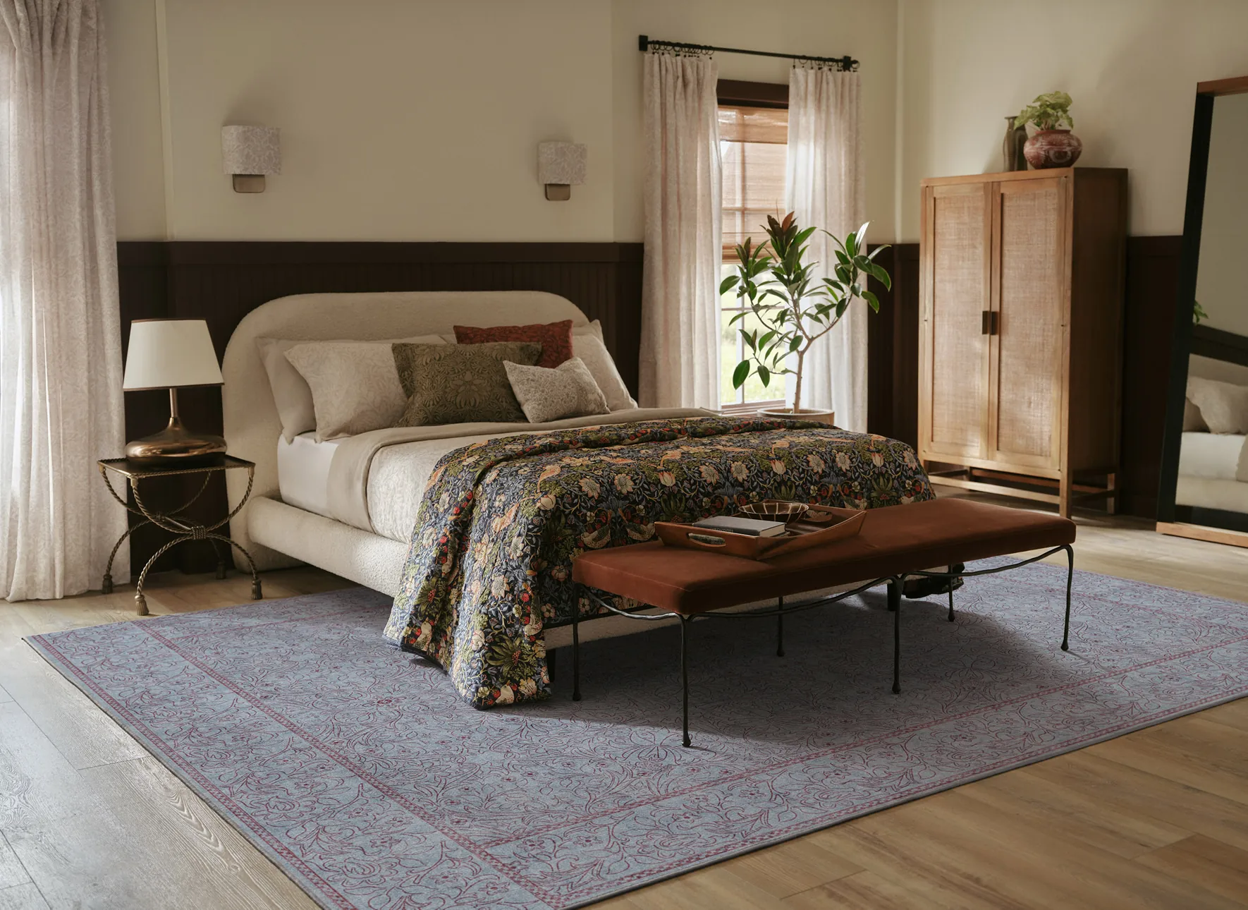 Bedroom styled with a blue Morris and Co rug from the Ruggable Unfinished Works collection