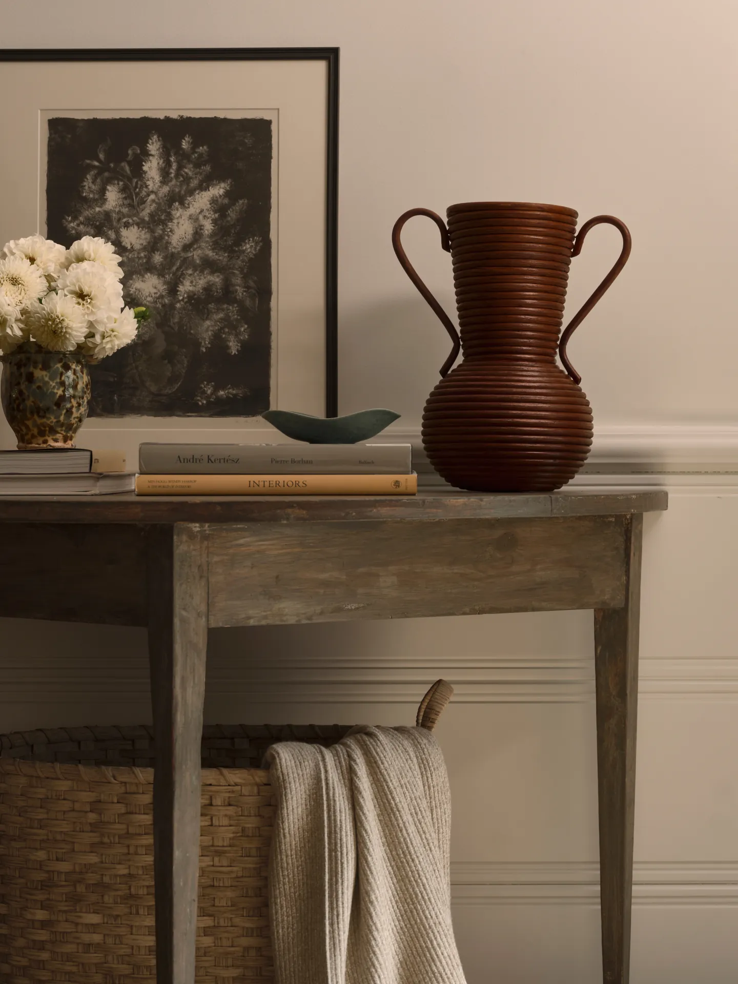 Console styled with a vase, books and a knit throw from the This Oak House collection