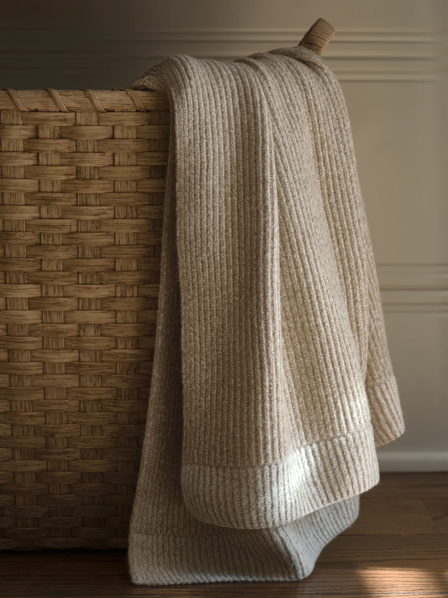 Textured knit throw from the Target This Oak House collection draped over a woven basket