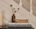 This Oak House collection tabletop styling with books, glassware and warm-toned decor