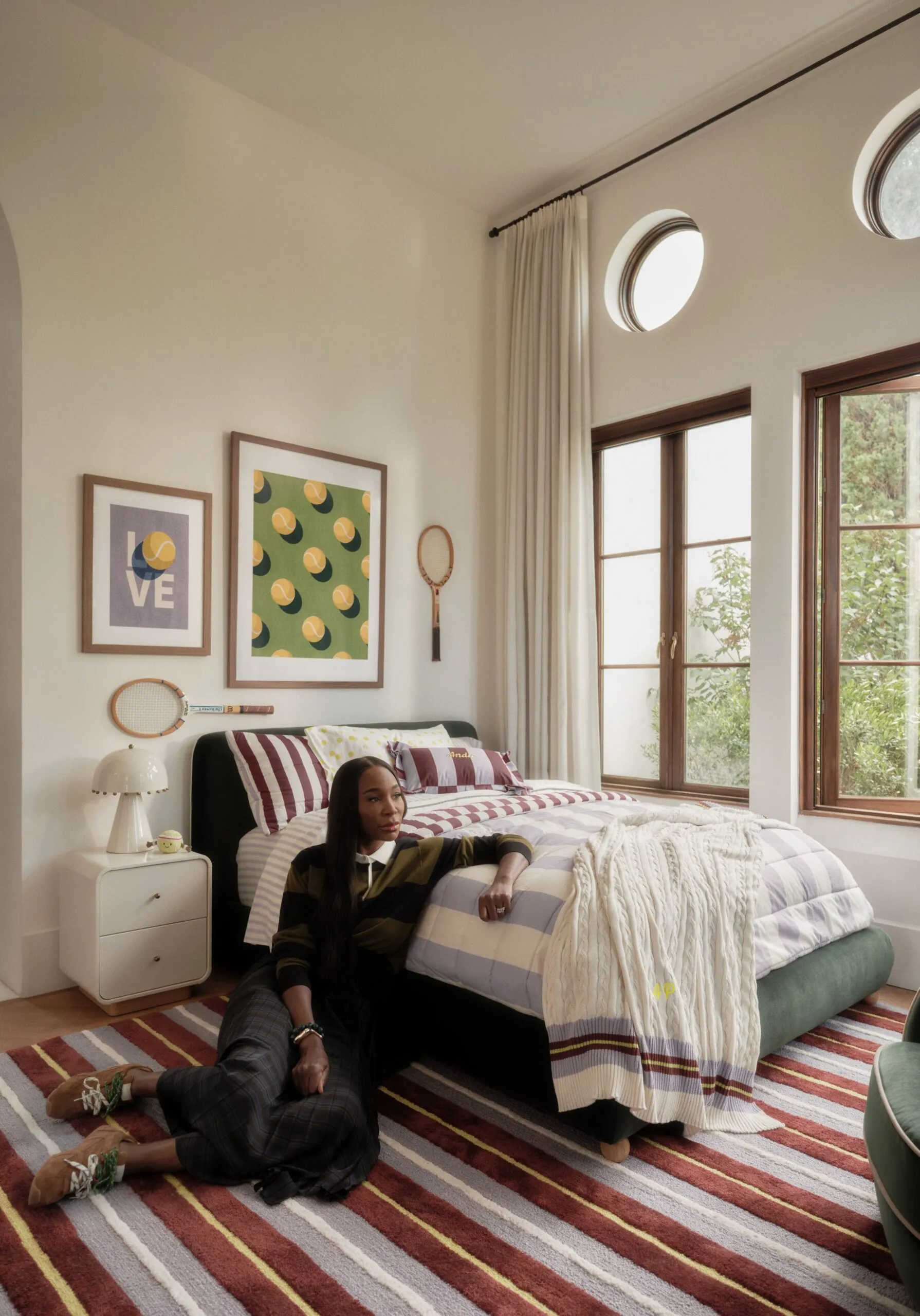 Venus Williams seated beside a bedroom from her Crate and Kids collection