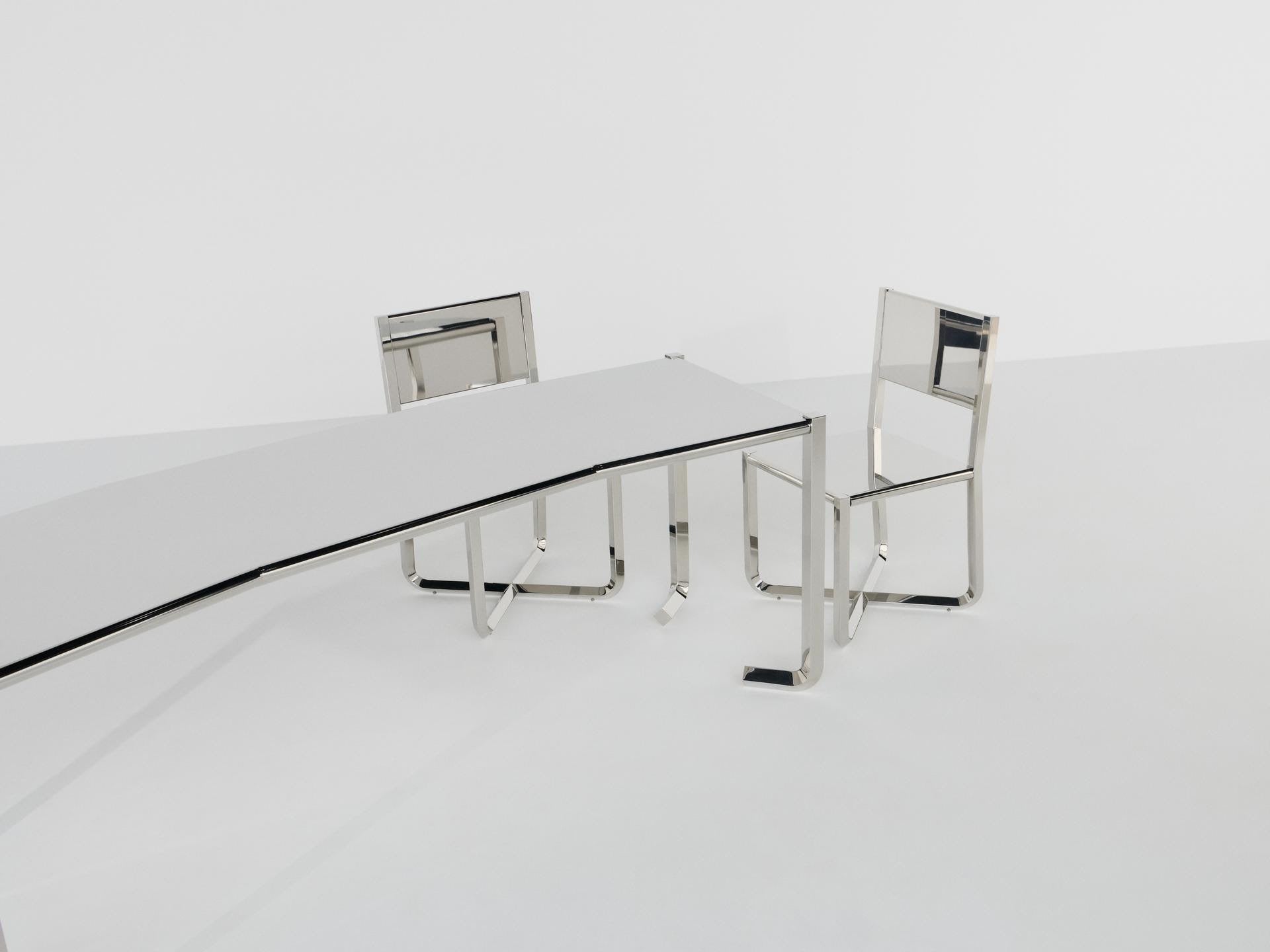 Round wood coffee tables with red feet from the Baisi Guadagnino collection