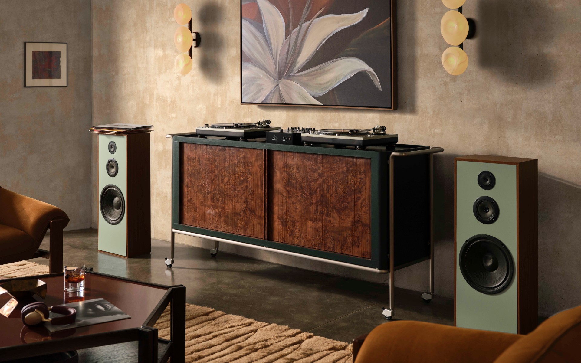 Lam-Louie burl wood DJ console positioned between two speakers