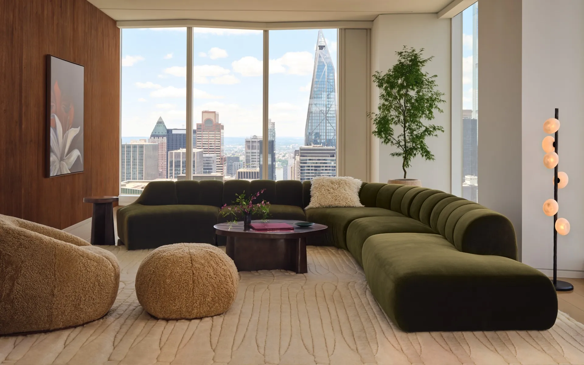 Olive curved sectional from the Casa Dean collection in a bright modern living room