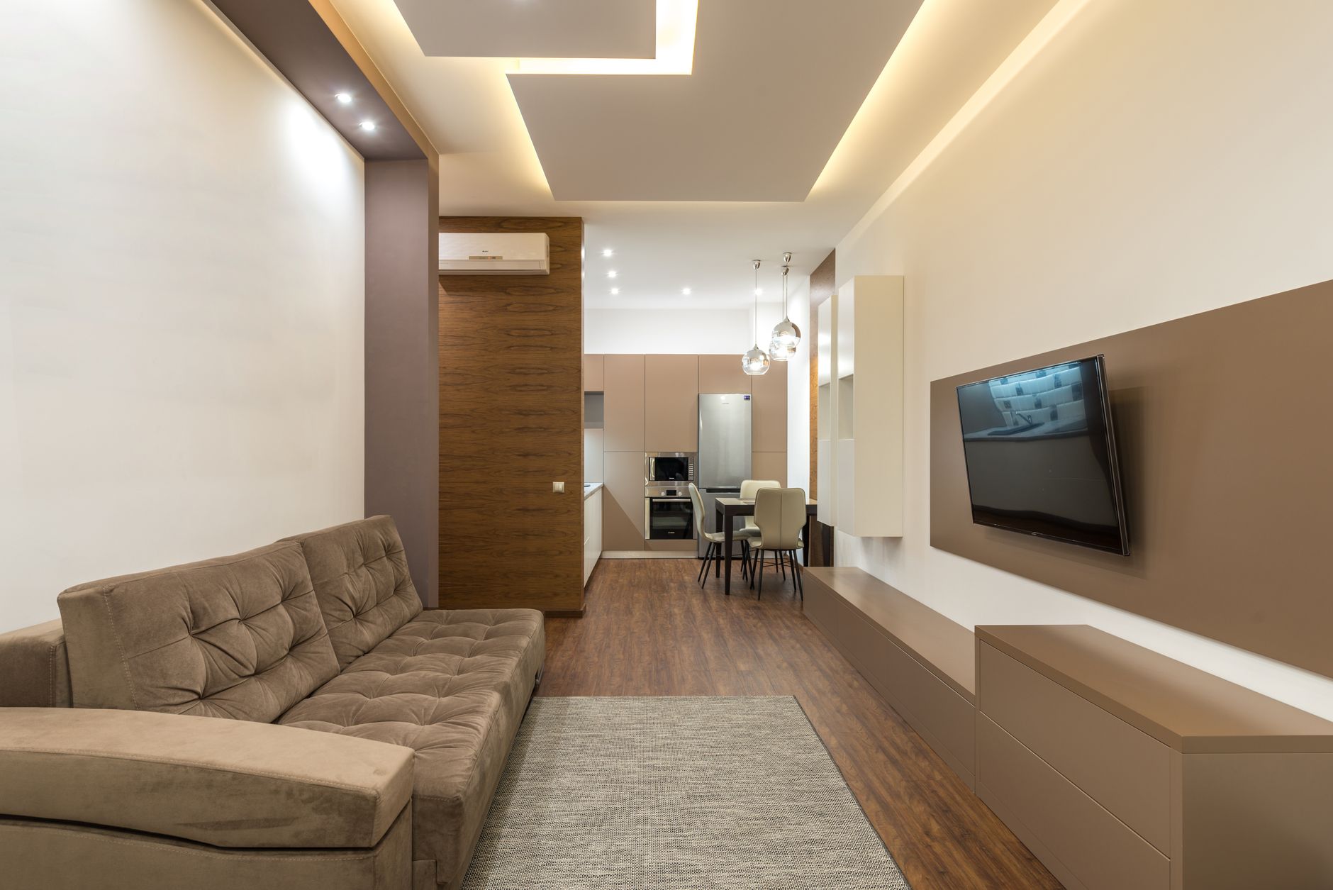 Living room arranged as a compact seating zone with open circulation around it
